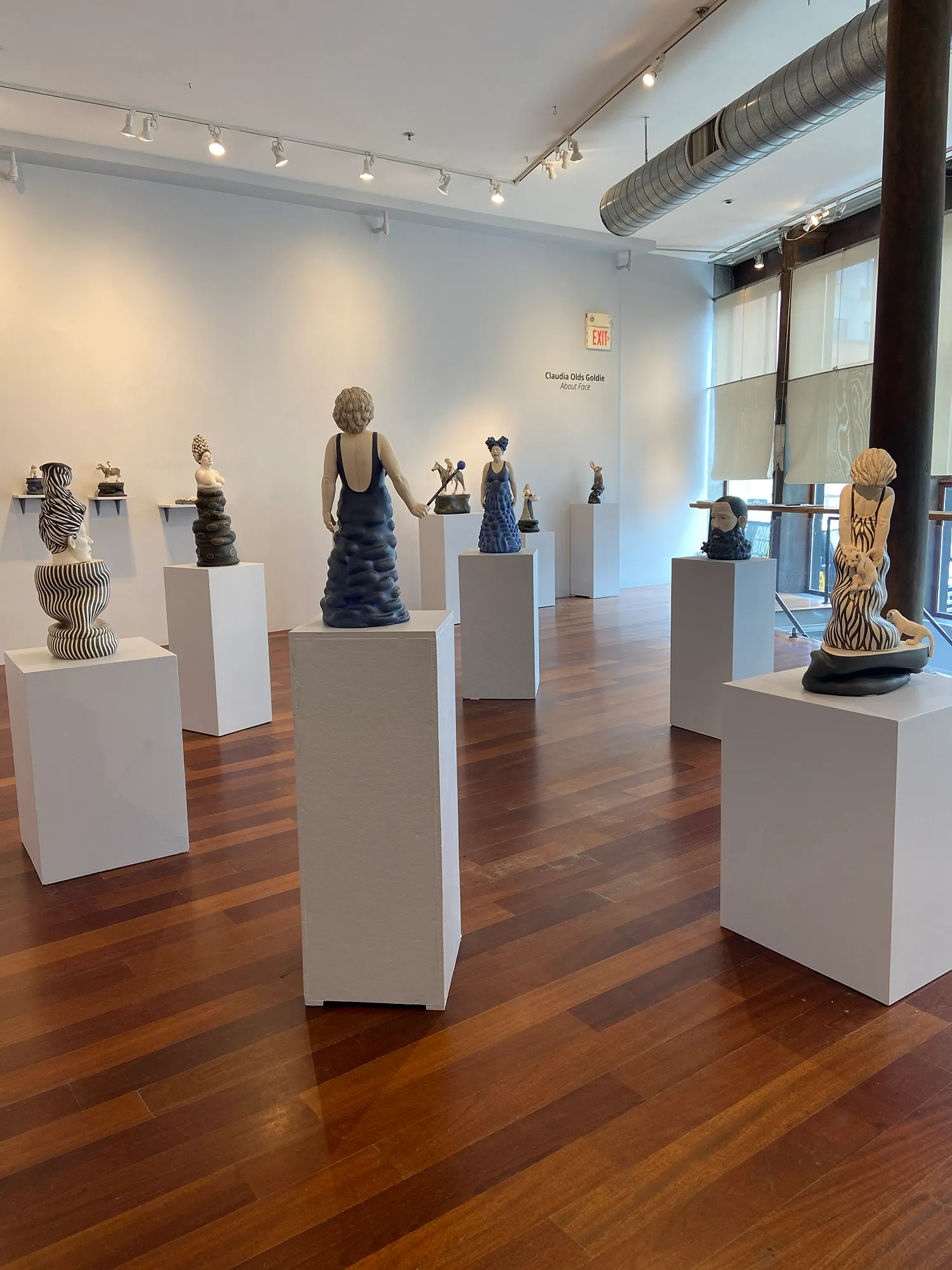 About Face — ceramic installation by Claudia Olds Goldie