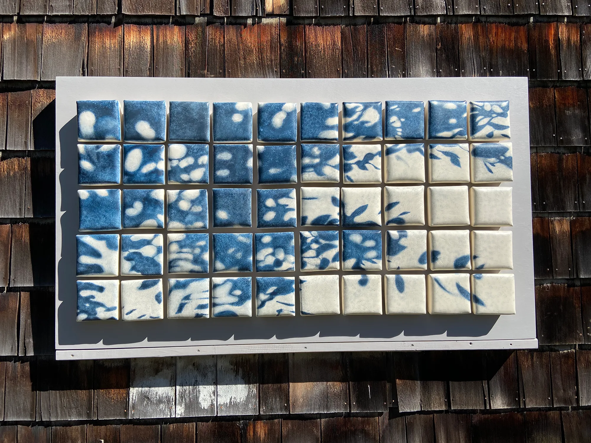 Dappled Light on Cobbles — ceramic installation by Claudia Olds Goldie